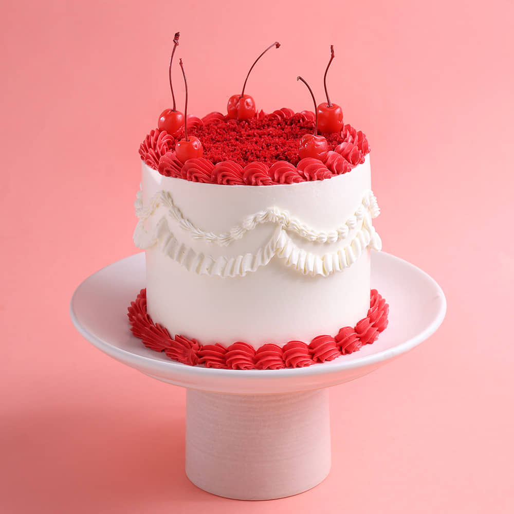 Side View of Cherries N Cheers Red Velvet Cake