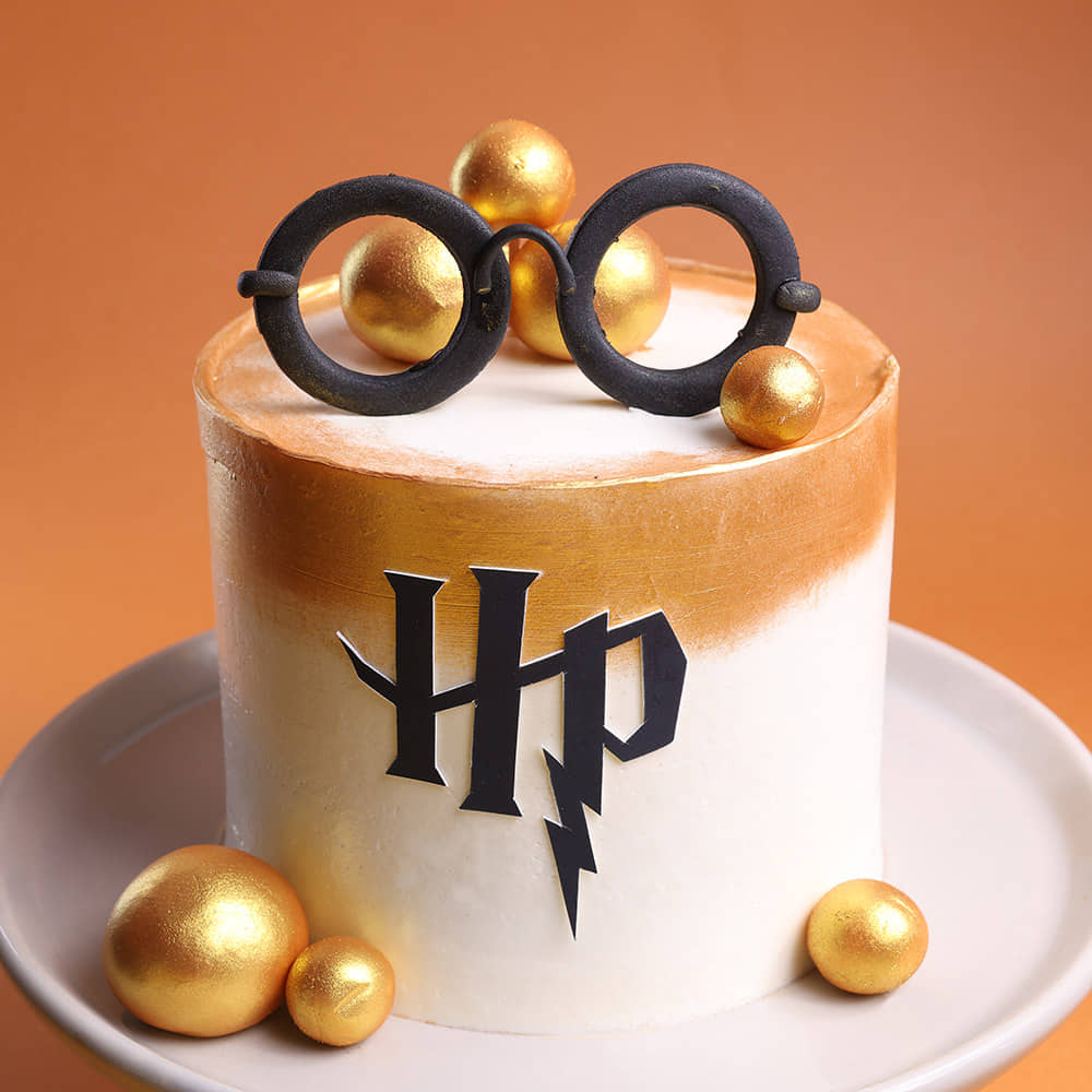 Harry Potter Charm Cake White and Gold HP cake with Wizard Glasses