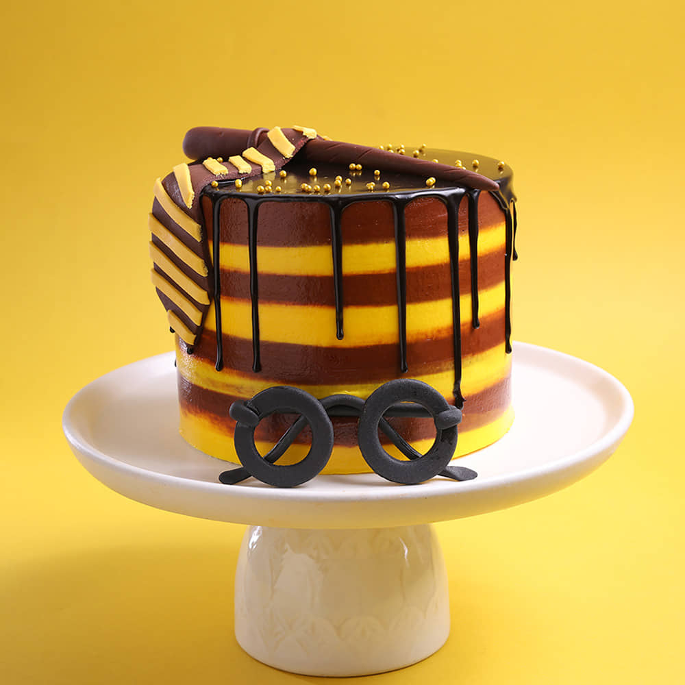 Harry Potter Gryffindor Theme Cake Yellow and Brown Harry Potter Cake with Tie and Wand