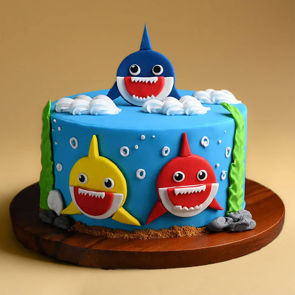 Side View of Smiling Baby Sharks Fondant Cake